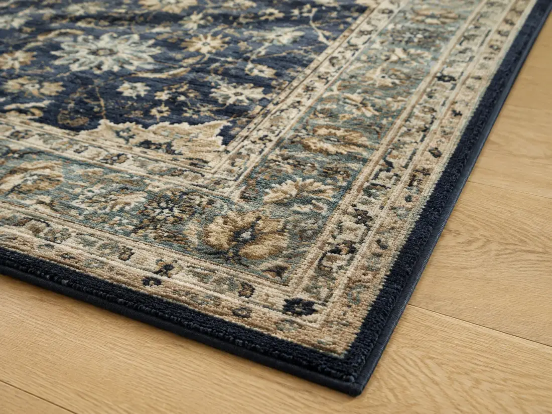 Close editorial view of a clean patterned wool rug